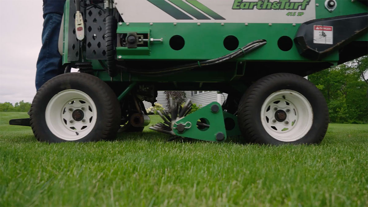 Thick green New England lawn after aeration and overseeding